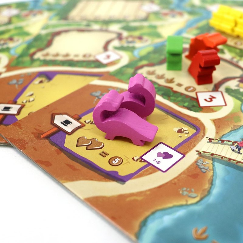 Draftosaurus: dinomeeples de madera, un dado que restringe dónde puedes colocarlos y el filler de dinosaurios que convence a cualquier grupo